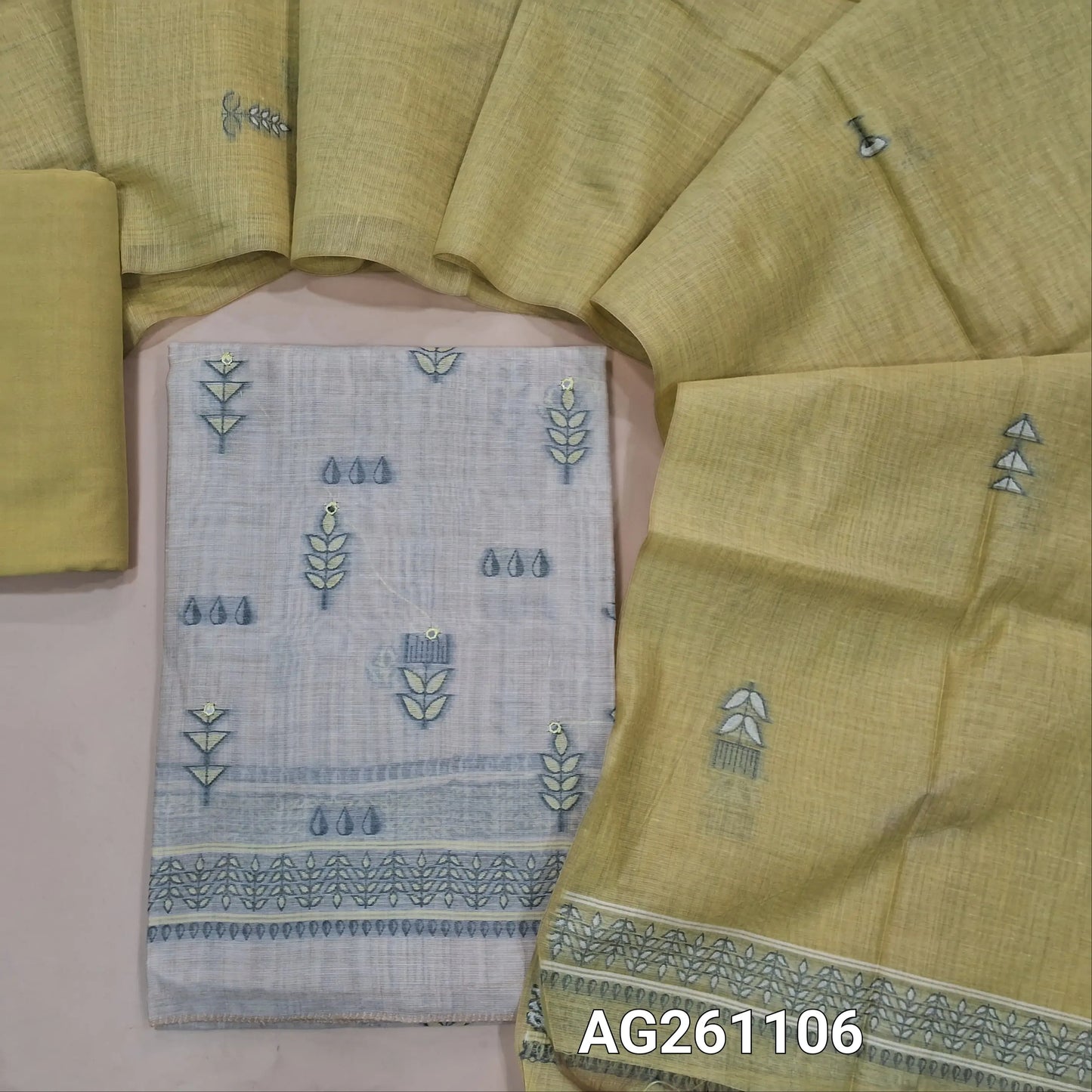 Beige silk cotton unstitched salwar material, faux mirror and thread weaving on front,(Lining Needed)yellow santoon bottom,thread wevaing on silk cotton dupatta with borders. AG261106