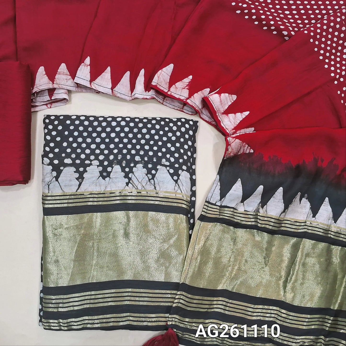 Black wax batik taspa silk unstitched salwar material, gold tissue daman,(lining needed) red silky bottom, batik design on taspa silk dupatta with gold tissue pallu. AG261110