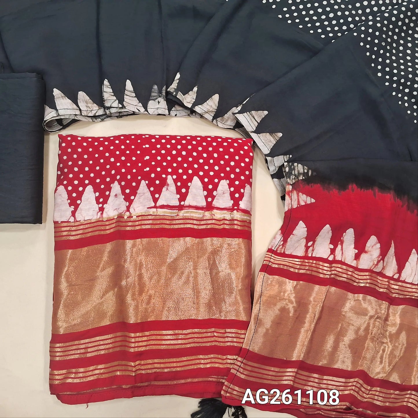 Red wax batik taspa silk unstitched salwar material, gold tissue daman,(lining needed)black silky bottom, batik design on taspa silk dupatta with gold tissue pallu. AG261108