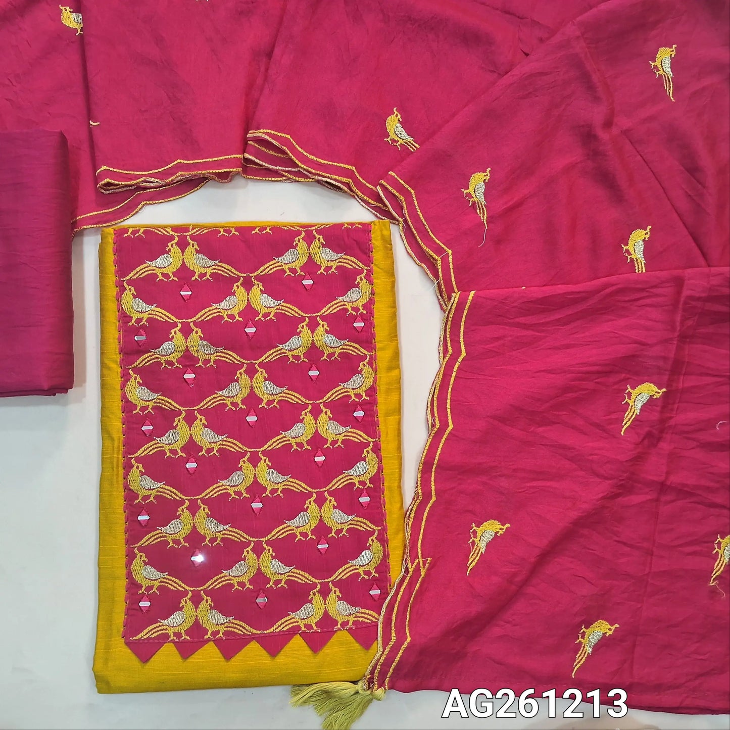 Mango yellow raw silk unstitched salwar material,contrast yoke patch with bird embroidery and real mirror(lining optional)bright pink silky bottom, bird embroidery on silk cotton dupatta with scallop borders. AG261211