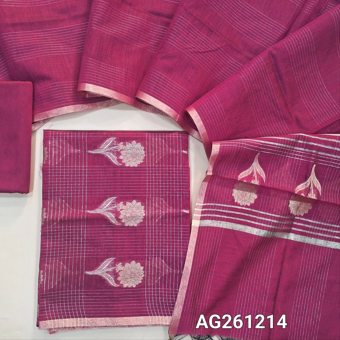Rani pink benarasi silk cotton unstitched salwar material,checked and floral zari weaving all over(Lining Needed)silk cotton bottom,vertical zari lines on silk cotton dupatta with floral weaving pallu and tassles. AG261214