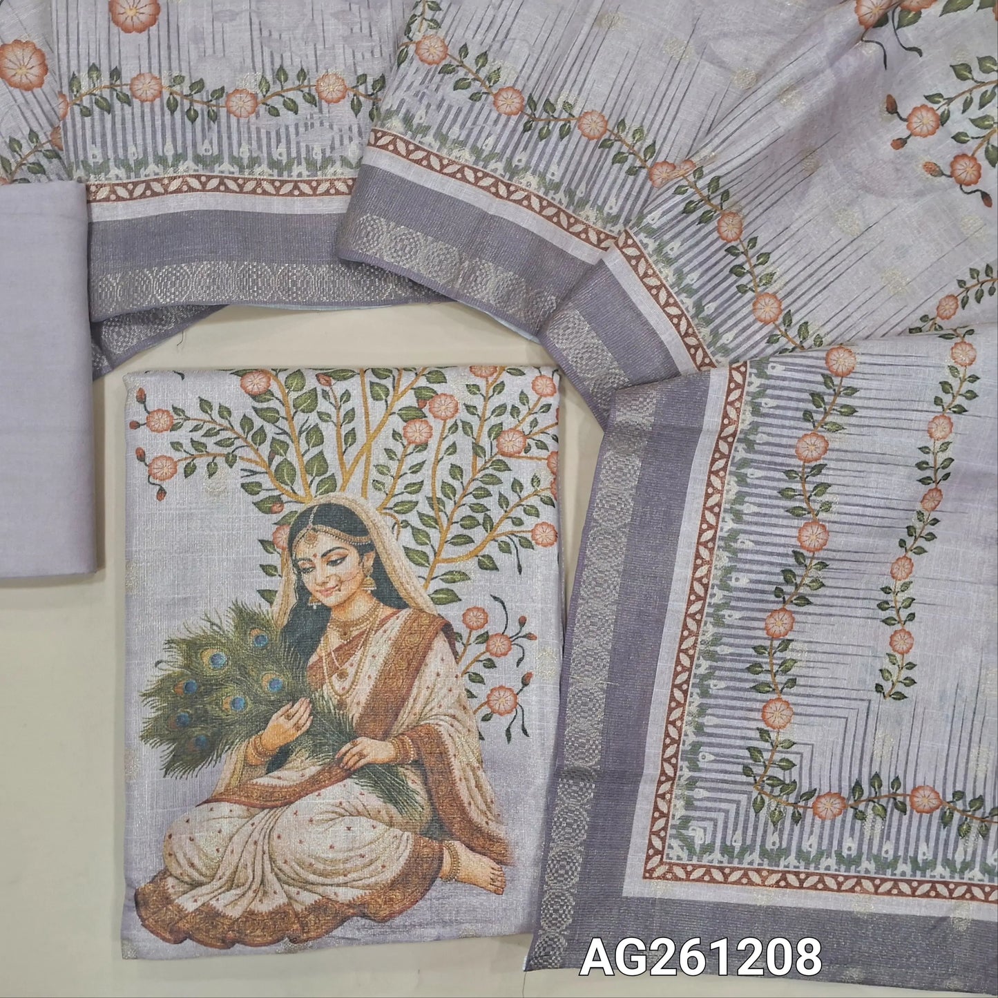 Light mauve with golden tint tissue silk cotton unstitched salwar material,zari buttas all over,digital printed daman, (lining needed)santoon bottom, zari buttas and digital printed tissue silk cotton dupatta with zari woven borders. AG261208