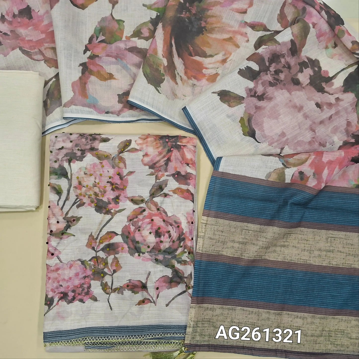 Light beige semi linen unstitched salwar material,printed all over,floral printed with french knot work and fancy lace tapping on daman,( lining needed)cotton bottom, floral printed semi linen dupatta. AG261321
