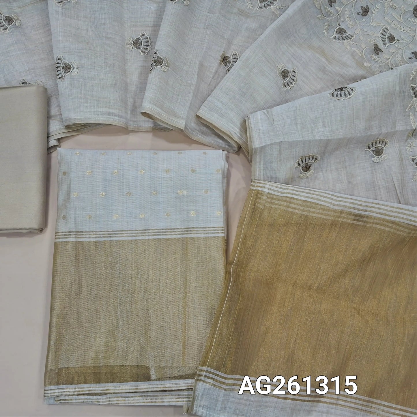 Rich beige silk cotton unstitched salwar material,zari buttas all over, golden tissue daman,(Lining Needed)spun cotton bottom, thread embroidery work on silk cotton dupatta with gold tissue pallu. AG261315