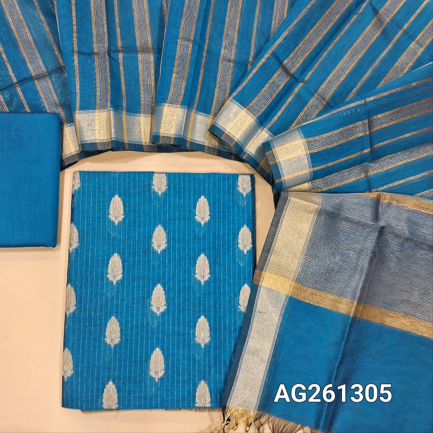 Teal blue benarasi silk cotton unstitched salwar material,zari woven buttas and zari lines all over,gold tissue daman,(Lining Needed)silk cotton bottom, gold tissue lines on tissue silk cotton dupatta with borders. AG261305