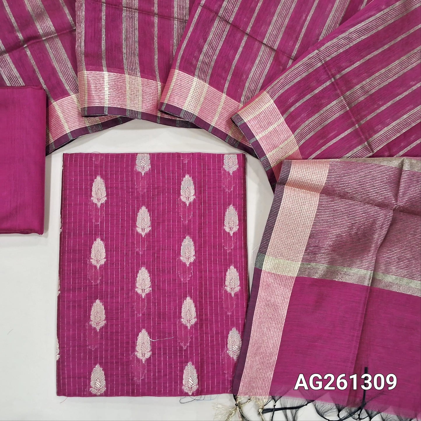 Rani pink benarasi silk cotton unstitched salwar material,zari woven buttas and zari lines all over,gold tissue daman,(Lining Needed)silk cotton bottom, gold tissue lines on tissue silk cotton dupatta with borders. AG261309