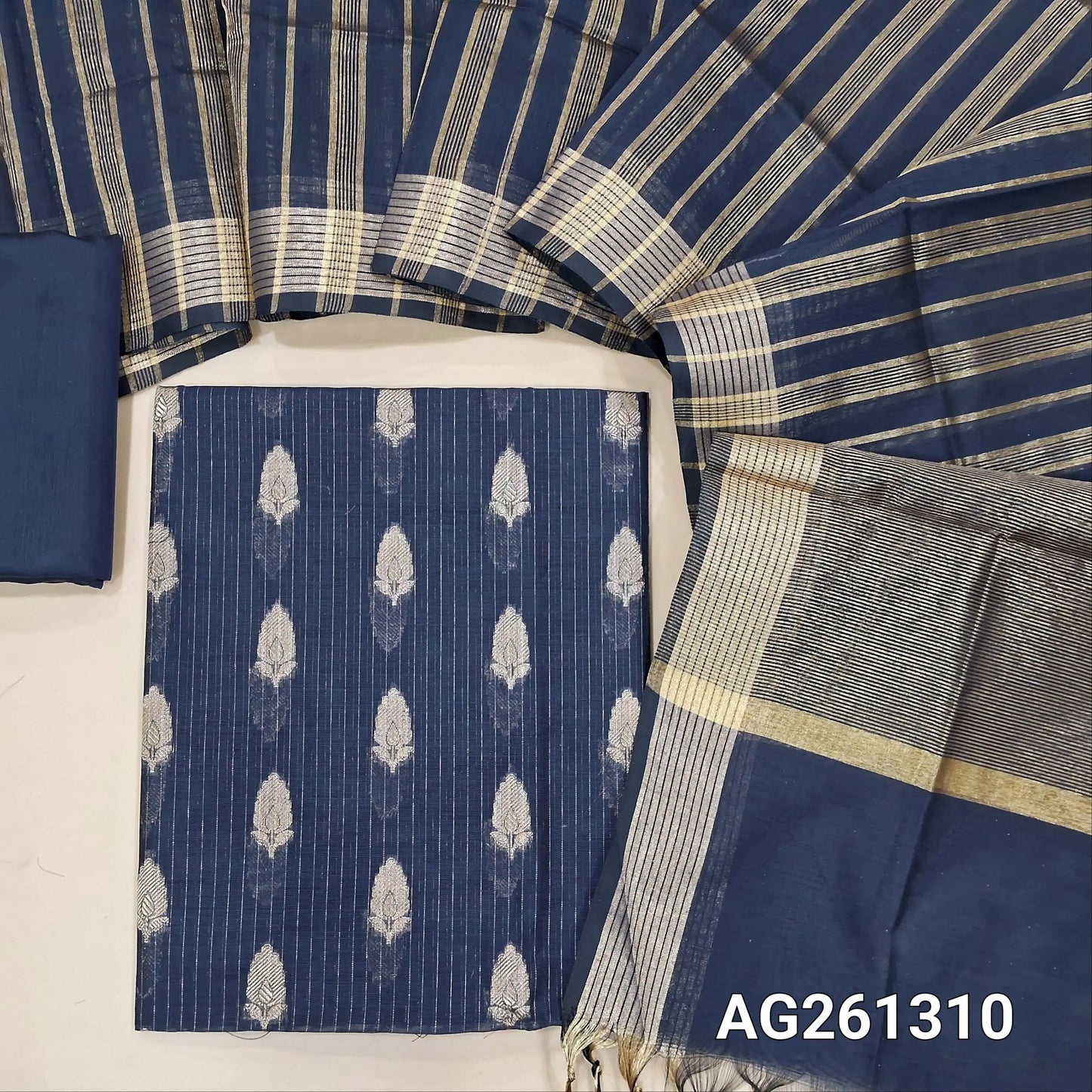 Dark blue benarasi silk cotton unstitched salwar material,zari woven buttas and zari lines all over,gold tissue daman,(Lining Needed)silk cotton bottom, gold tissue lines on tissue silk cotton dupatta with borders. AG261310
