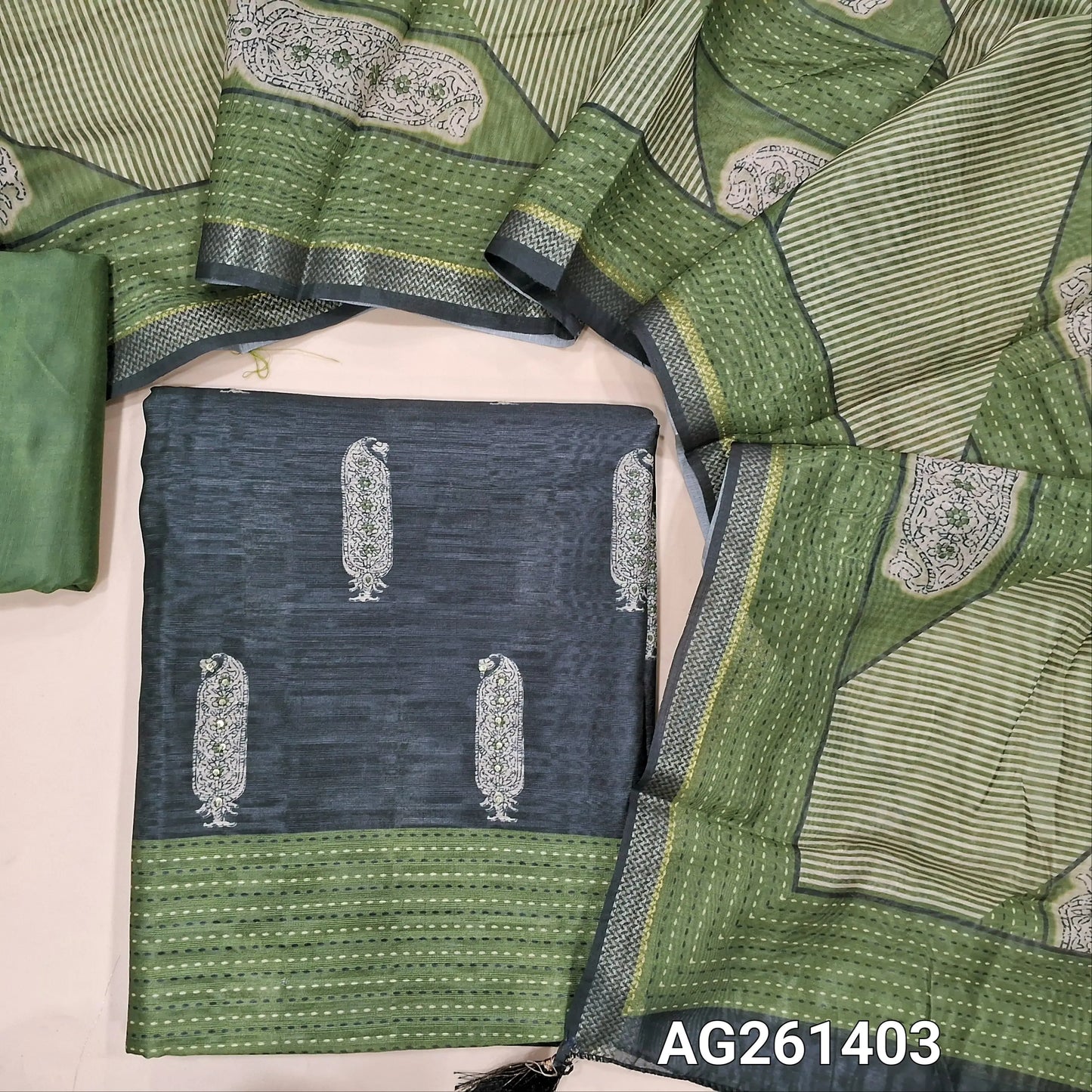 Black jute silk unstitched salwar material, digital printed with sequins work on front, (textured, lining needed)olive green silky bottom,digital printed jute silk dupatta with zari woven borders. AG261403
