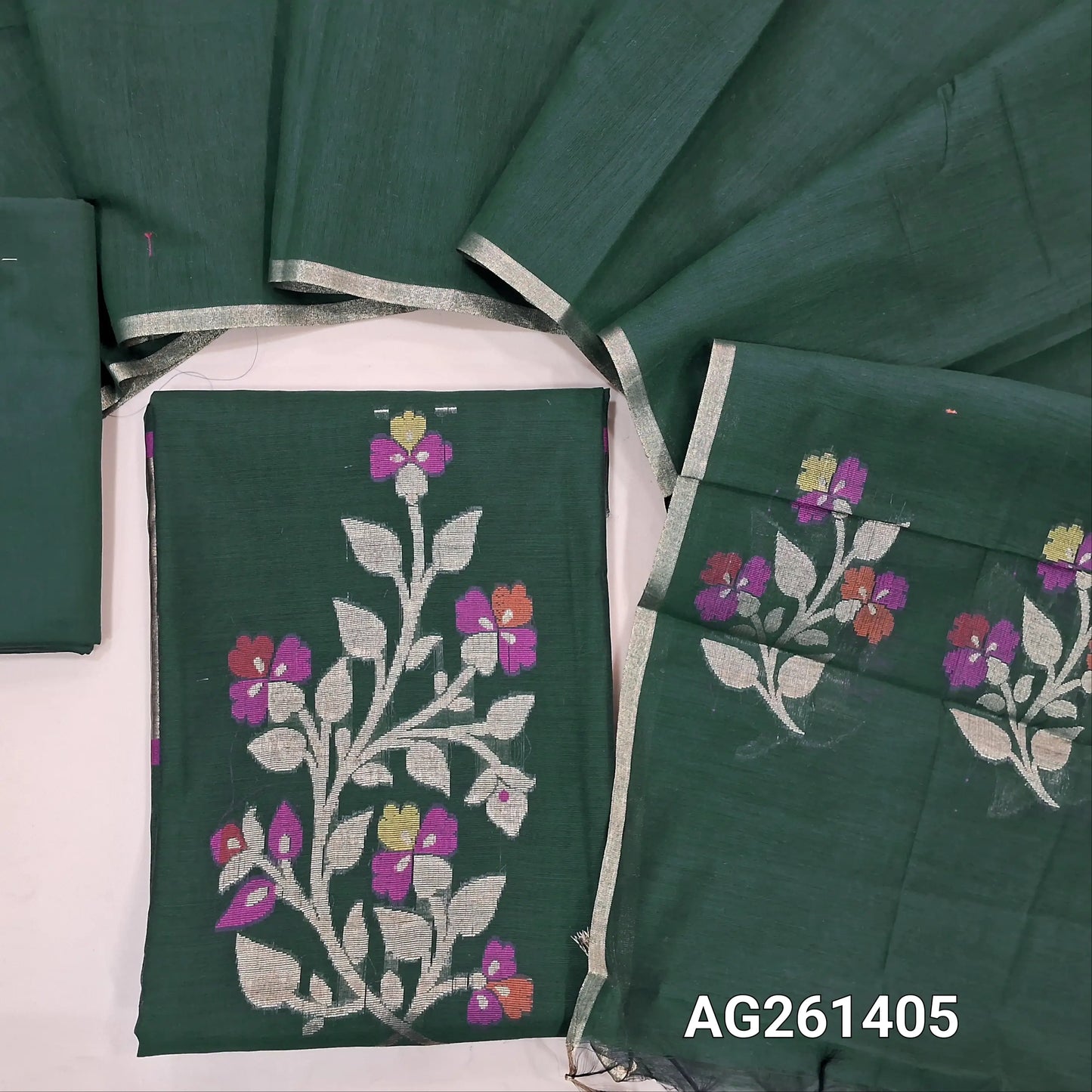 Dark green silk cotton unstitched salwar material,zari and meenakari weaving on front,gold tissue daman,(Lining Needed)silk cotton bottom, silk cotton dupatta with weaving pallu. AG261405