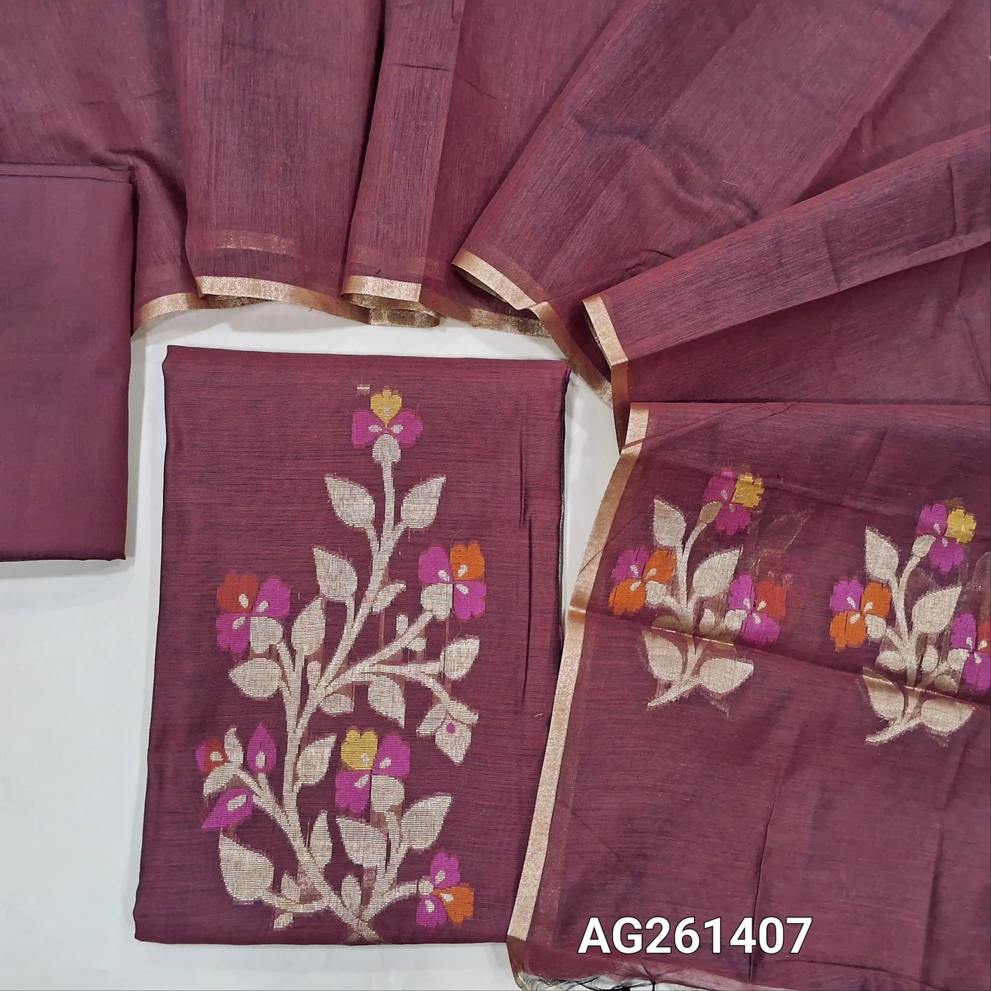 Dark maroon silk cotton unstitched salwar material,zari and meenakari weaving on front,gold tissue daman,(Lining Needed)silk cotton bottom, silk cotton dupatta with weaving pallu. AG261407
