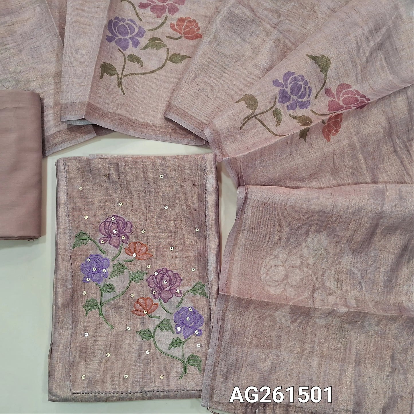 Pastel pink with golden tint Tissue silk unstitched salwar material, embroidery and sequins work on yoke,(lining needed)silky bottom,digital printed on metallic tissue silk dupatta with fancy tassles. AG261501