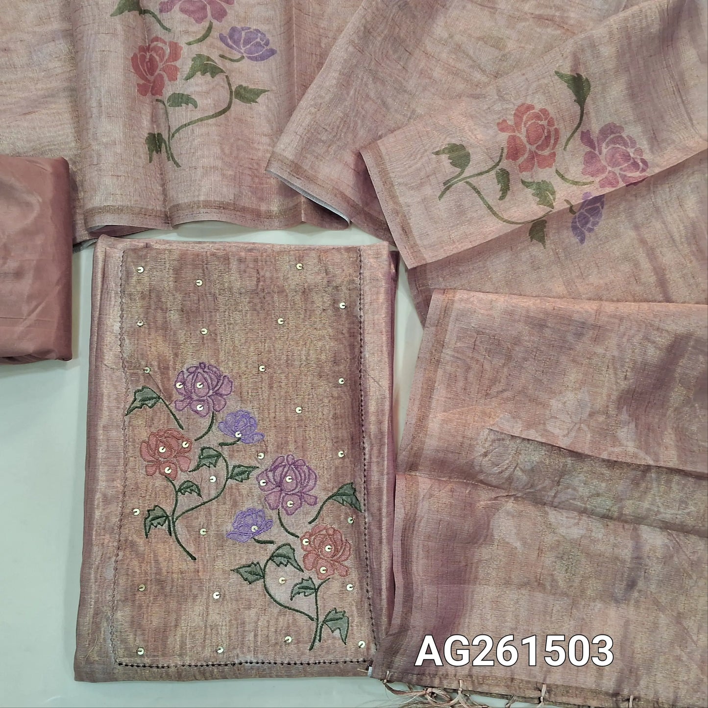 Light peachish pink with golden tint Tissue silk unstitched salwar material, embroidery and sequins work on yoke,(lining needed)silky bottom,digital printed on metallic tissue silk dupatta with fancy tassles. AG261503