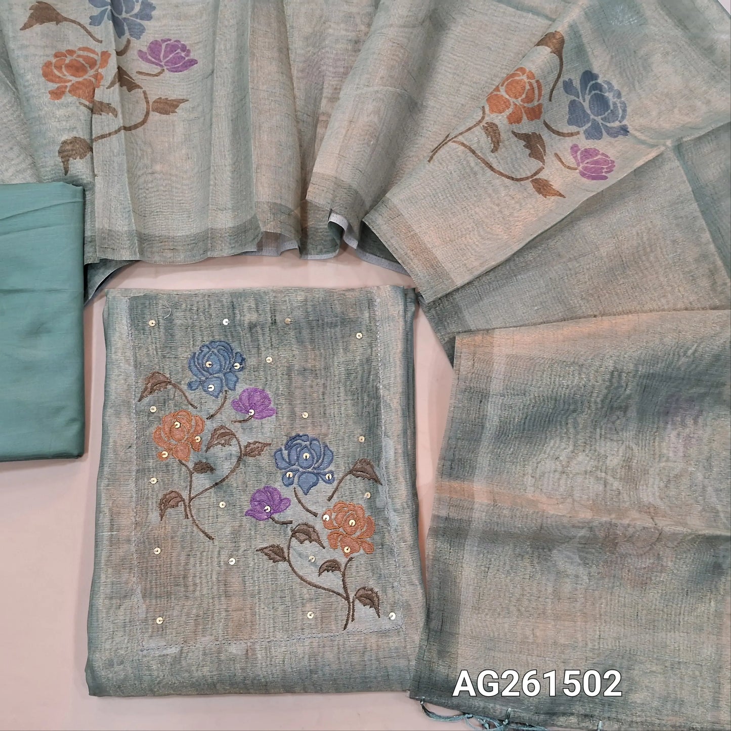 Green with golden tint Tissue silk unstitched salwar material, embroidery and sequins work on yoke,(lining needed)silky bottom,digital printed on metallic tissue silk dupatta with fancy tassles. AG261502