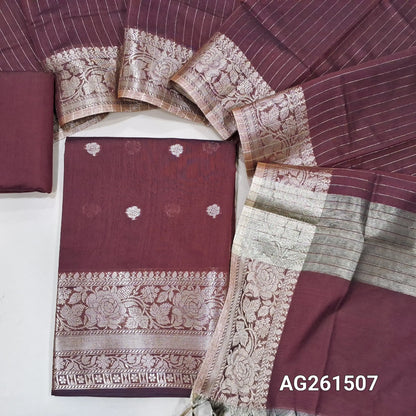 Dark maroon benarasi silk cotton unstitched salwar material,checked design on yoke,buttas on front,antic gold zari weaving daman,(Lining Needed)silk cotton bottom,zari lines on silk cotton dupatta with tissue pallu and borders. AG261507