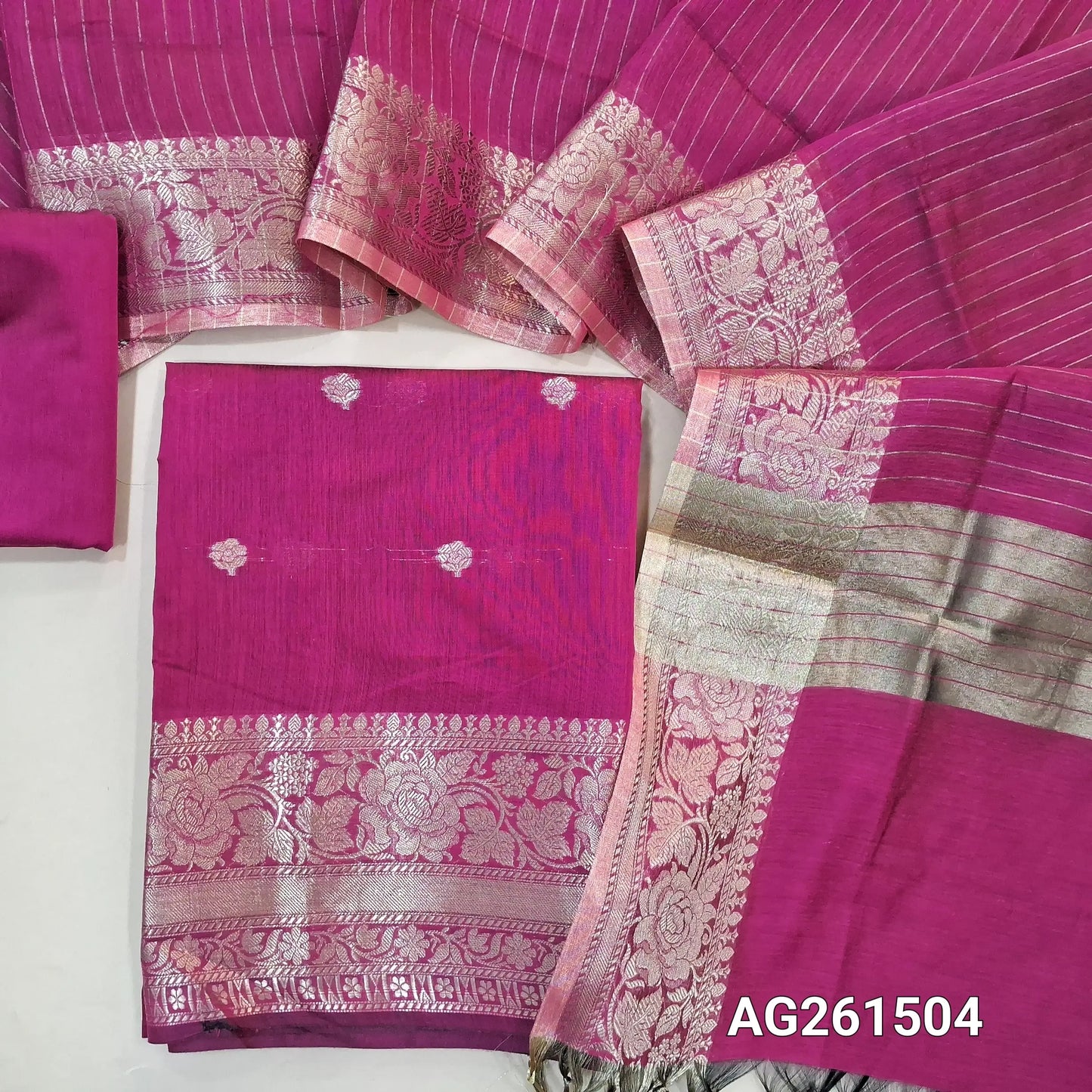 Rani pink benarasi silk cotton unstitched salwar material,checked design on yoke,buttas on front,antic gold zari weaving daman,(Lining Needed)silk cotton bottom,zari lines on silk cotton dupatta with tissue pallu and borders. AG261504