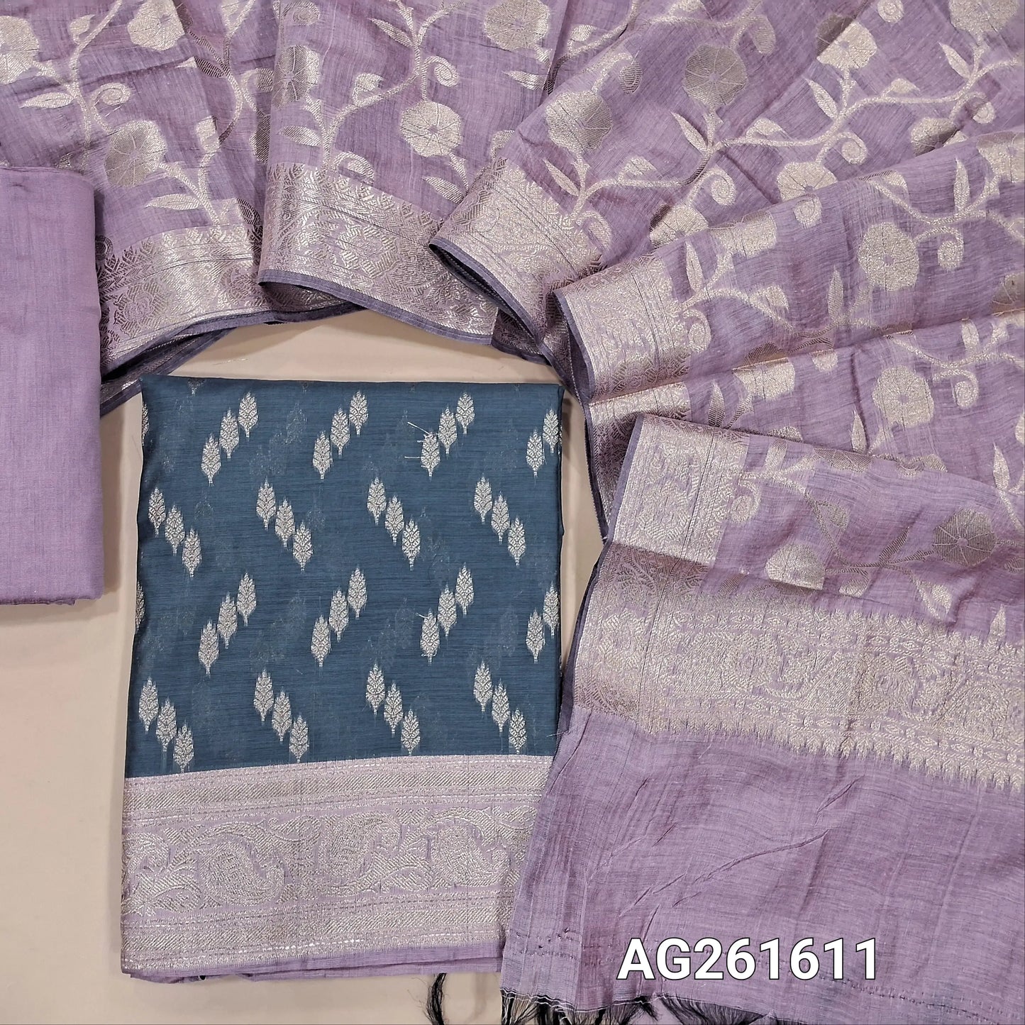 Dark grey benarasi silk cotton unstitched salwar material, zari buttas all over,antic gold zari weaving on daman,(Lining needed)mauve silk cototn bottom, benarasi zari woven silk cotton dupatta with borders. AG261611
