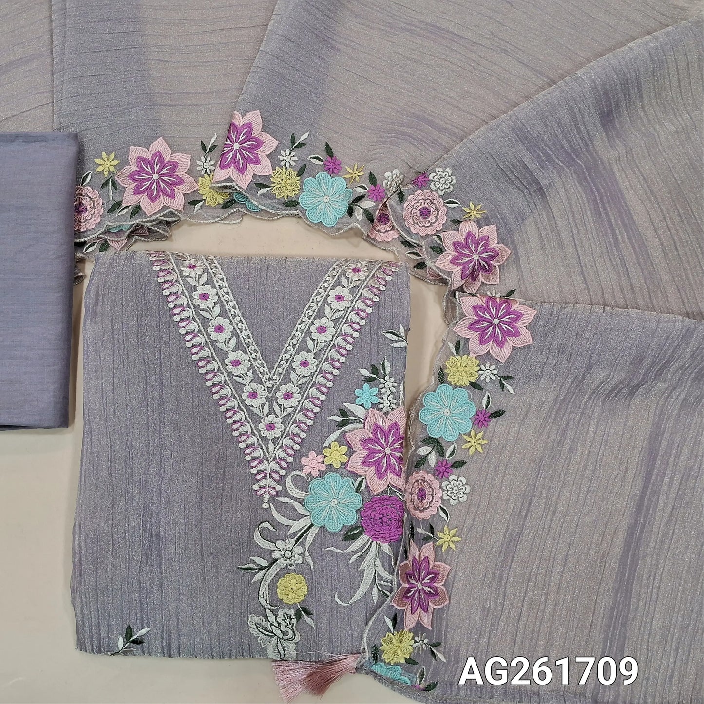 Purple with golden tint crinkled tissue organza silk unstitched salwar material, v neck with 3D thread embroidery yoke,embroidery work on front(lining needed)santoon bottom, crinkled tissue organza silk dupatta with embroidered scallop borders. AG261709