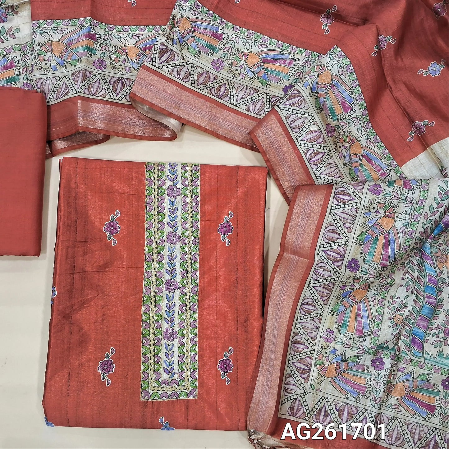 Designer brick red semi tussar unstitched salwar material,digital printed with embroidered yoke,printed with french knot work on front,(lining needed)santoon bottom, semi tussar silk dupatta with madhubani printed pallu and tissue borders. AG261701