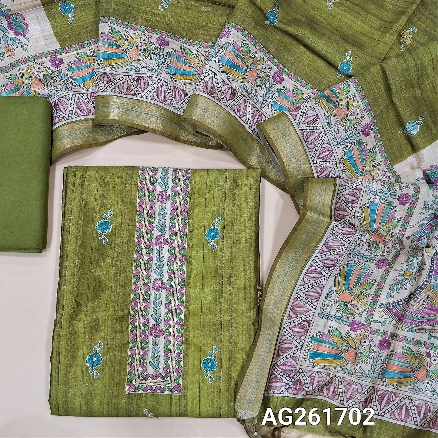Designer leafy green semi tussar unstitched salwar material,digital printed with embroidered yoke,printed with french knot work on front,(lining needed)santoon bottom, semi tussar silk dupatta with madhubani printed pallu and tissue borders. AG261702