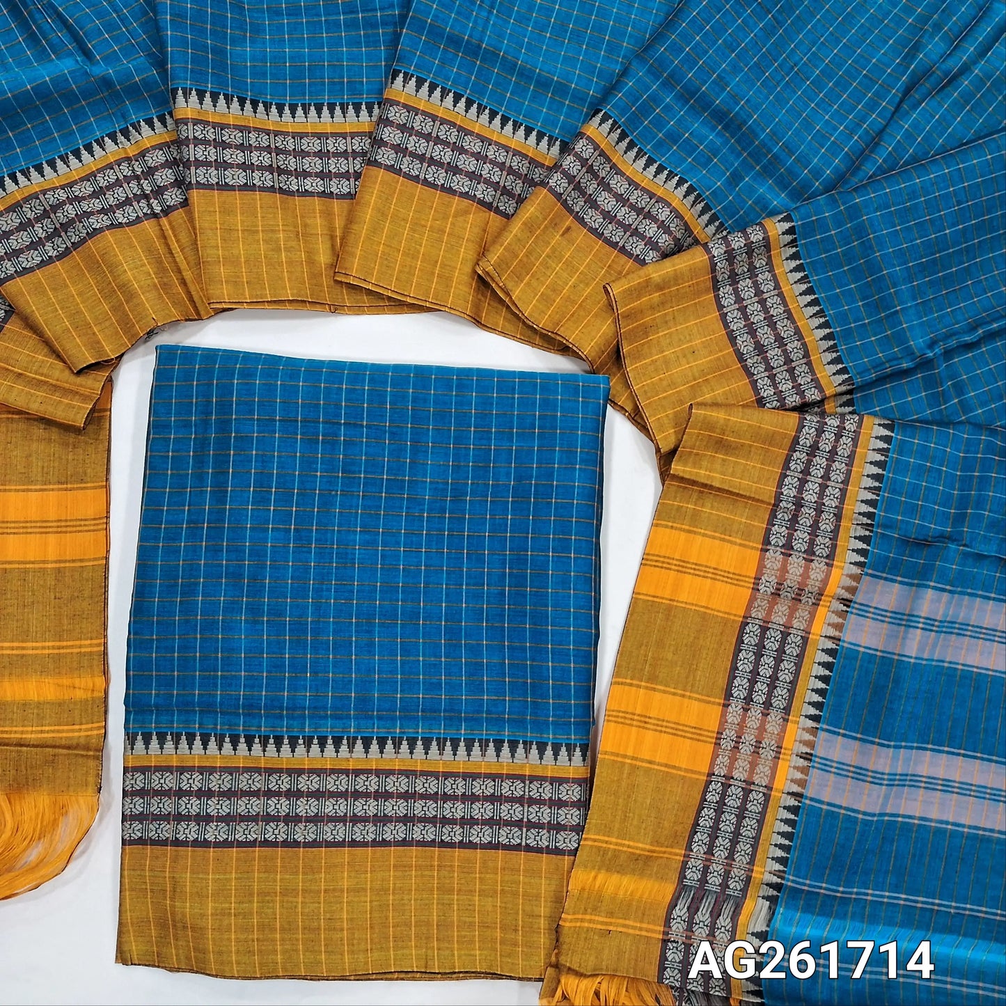 Peacock blue mercerized handloom cotton unstitched salwar material(thin, lining needed) checked all over with contrast traditional thread woven border, bottom included with top, checked mercerized handloom cotton dupatta with borders and tassels. AG261714