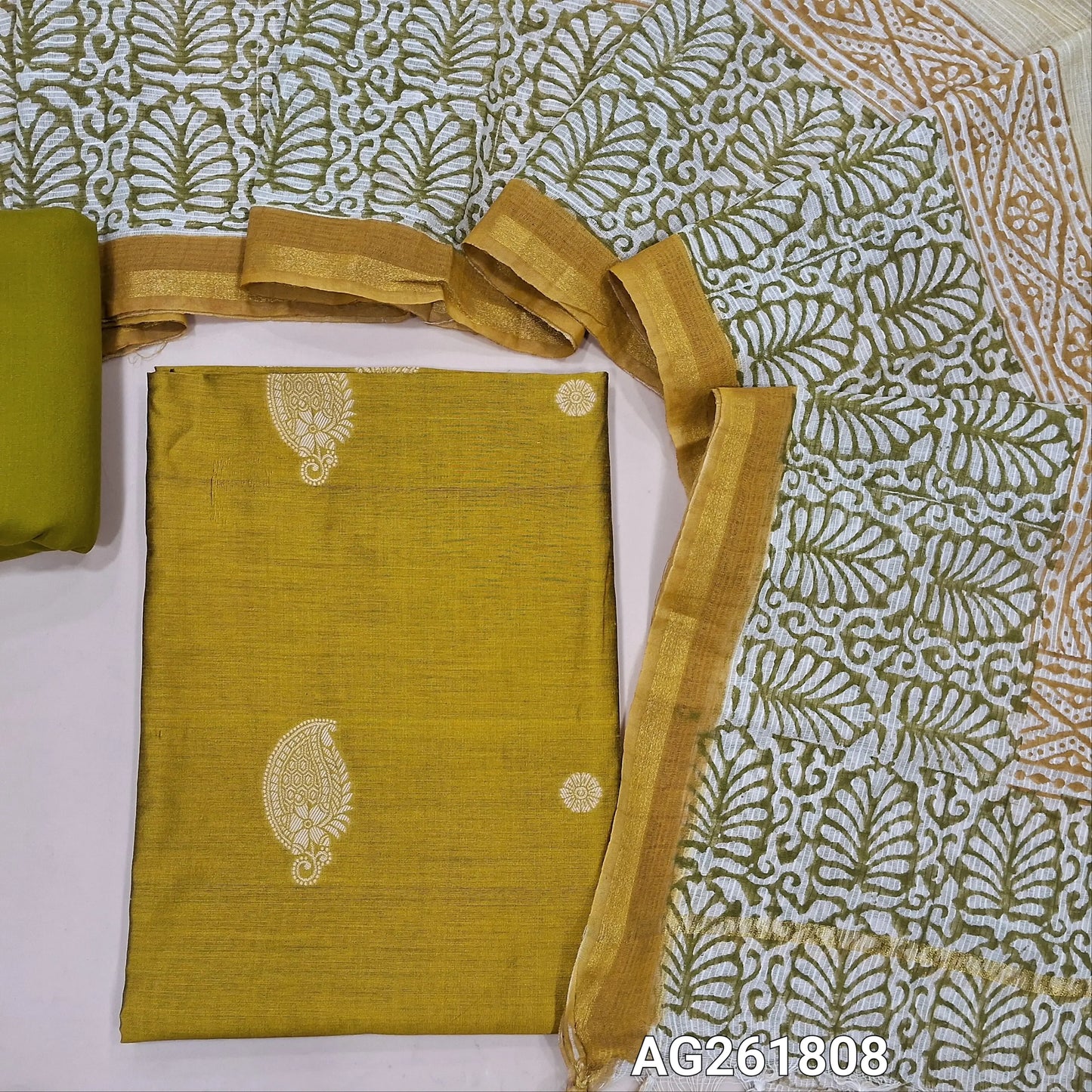 Mehandhi yellow benarasi silk cotton unstitched salwar material, thread woven buttas all over(Lining needed)mehandhi green spun cotton bottom,hand block printed pure kota cotton dupatta with tissue borders. AG261808