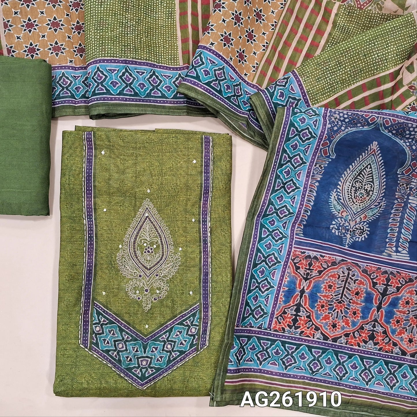 green digital printed soft silk cotton unstitched salwar material,zari embroidery and printed yoke,(Lining Needed) santoon bottom, ajrak digital printed silk cotton dupatta. AG261910
