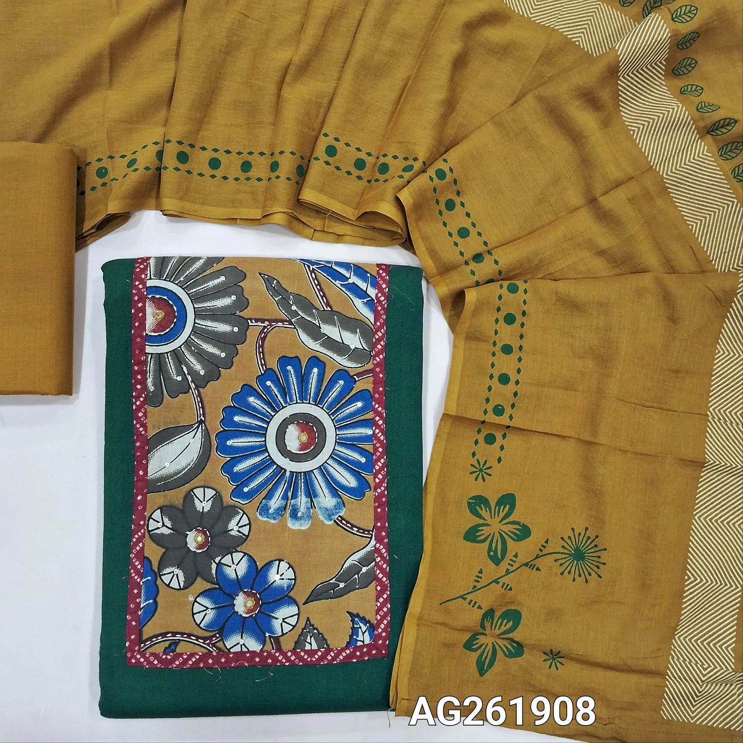 Dark green pure cotton unstitched salwar material,kalamkari yoke patch with kantha stitch, sequins and mirror work,(lining optional)mehandhi yellow cotton bottom,hand block printed soft mul cotton dupatta. AG261908
