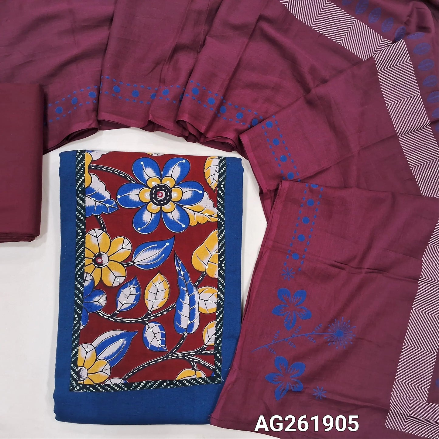 Blue cotton unstitched salwar material,kalamkari yoke patch with kantha stitch, sequins and mirror work,(lining optional)reddish maroon cotton bottom,hand block printed soft mul cotton dupatta. AG261905