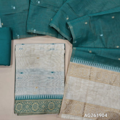 Off white silk cotton unstitched salwar material,contrast yoke with zari weaving border, gap border on daman,(Lining Needed)teal blue spun cotton bottom, silk cotton dupatta with contrast pallu with gap borders. AG261904