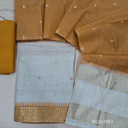 Off white silk cotton unstitched salwar material,contrast yoke with zari weaving border, gap border on daman,(Lining Needed)mehandhi yellow spun cotton bottom, silk cotton dupatta with contrast pallu with gap borders. AG261903