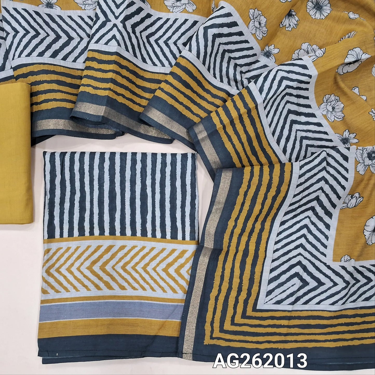 Black base soft silk cotton unstitched salwar material, vertical printed all over,(lining needed)yellow cotton bottom,digital printed silk cotton dupatta with tissue borders. AG262013