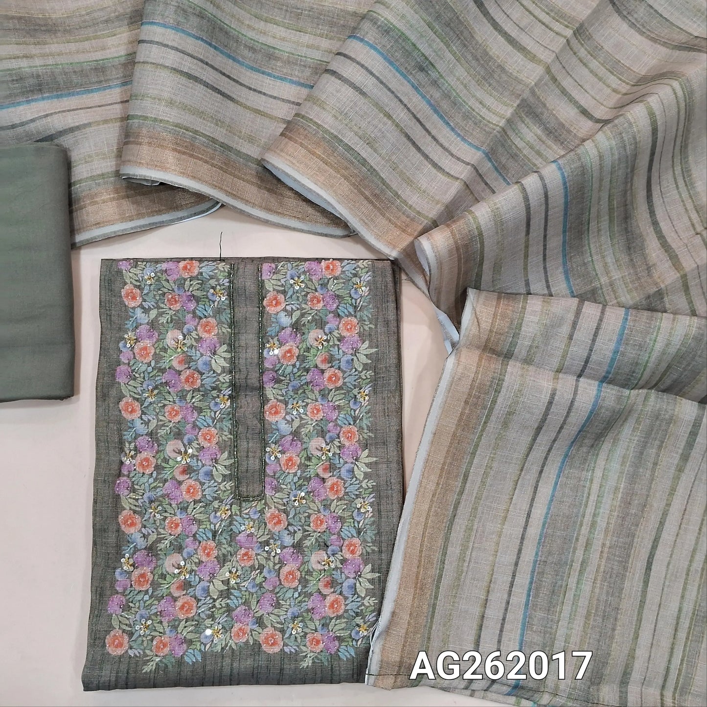 Light olive green with golden tint tissue linen unstitched salwar material, floral printed with cut bead & sugar bead on yoke,(lining needed) spun cotton bottom,vertical printed tissue linen dupatta with tissue borders. AG262017