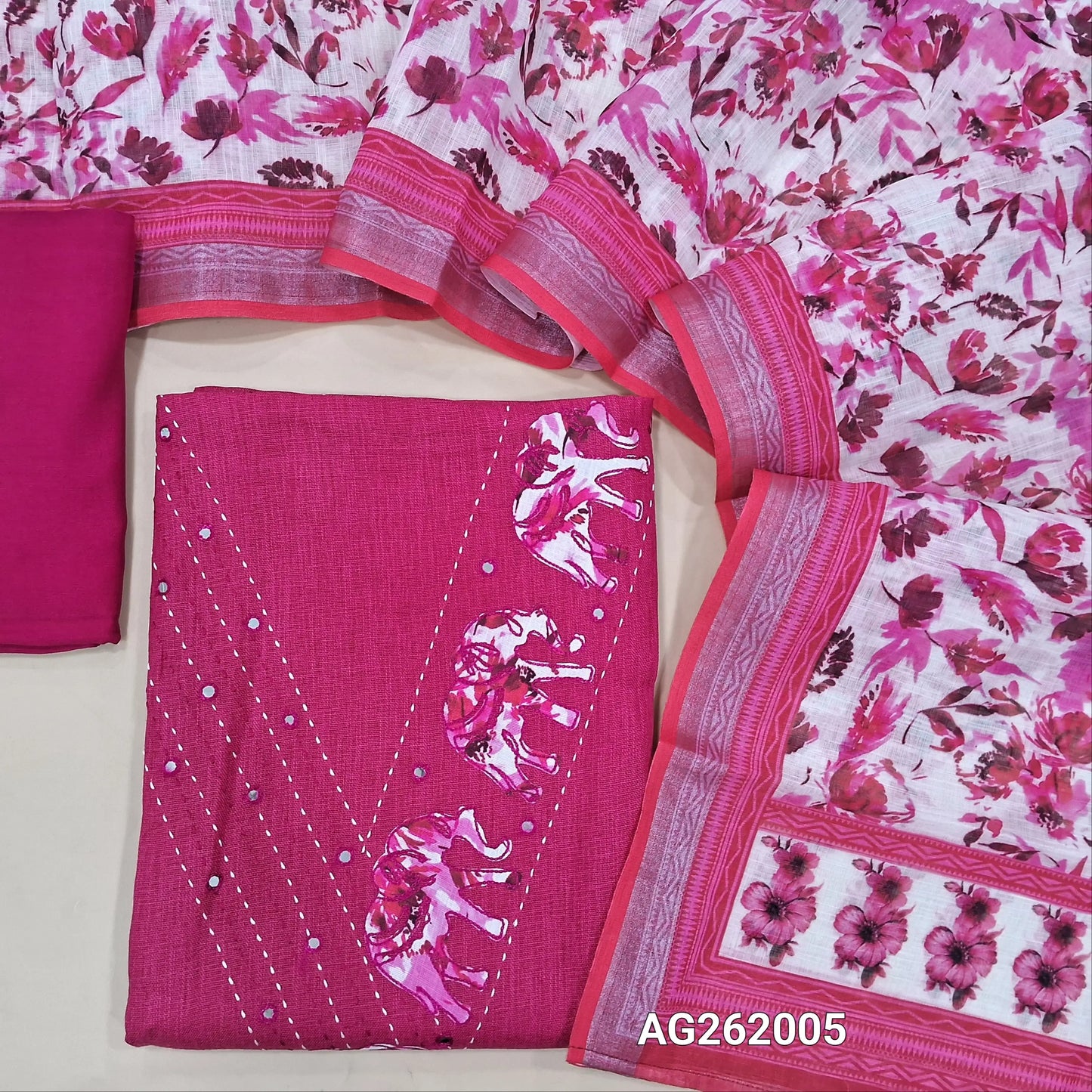 Bright pink semi linen unstitched salwar material,v neck with applique work, kantha stitch & foil work( lining optional)santoon bottom,floral printed semi linen dupatta with silver tissue borders. AG262005