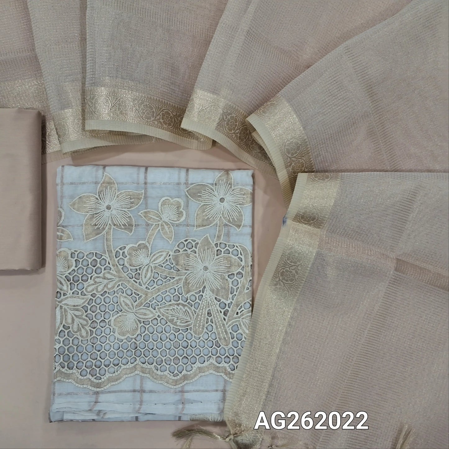 Off white silk cotton unstitched salwar material,zari checks and embroidery on front,applique work and cutwork on daman,(Lining Needed)silk cotton bottom,zari checks on silk cotton dupatta with borders. AG262022