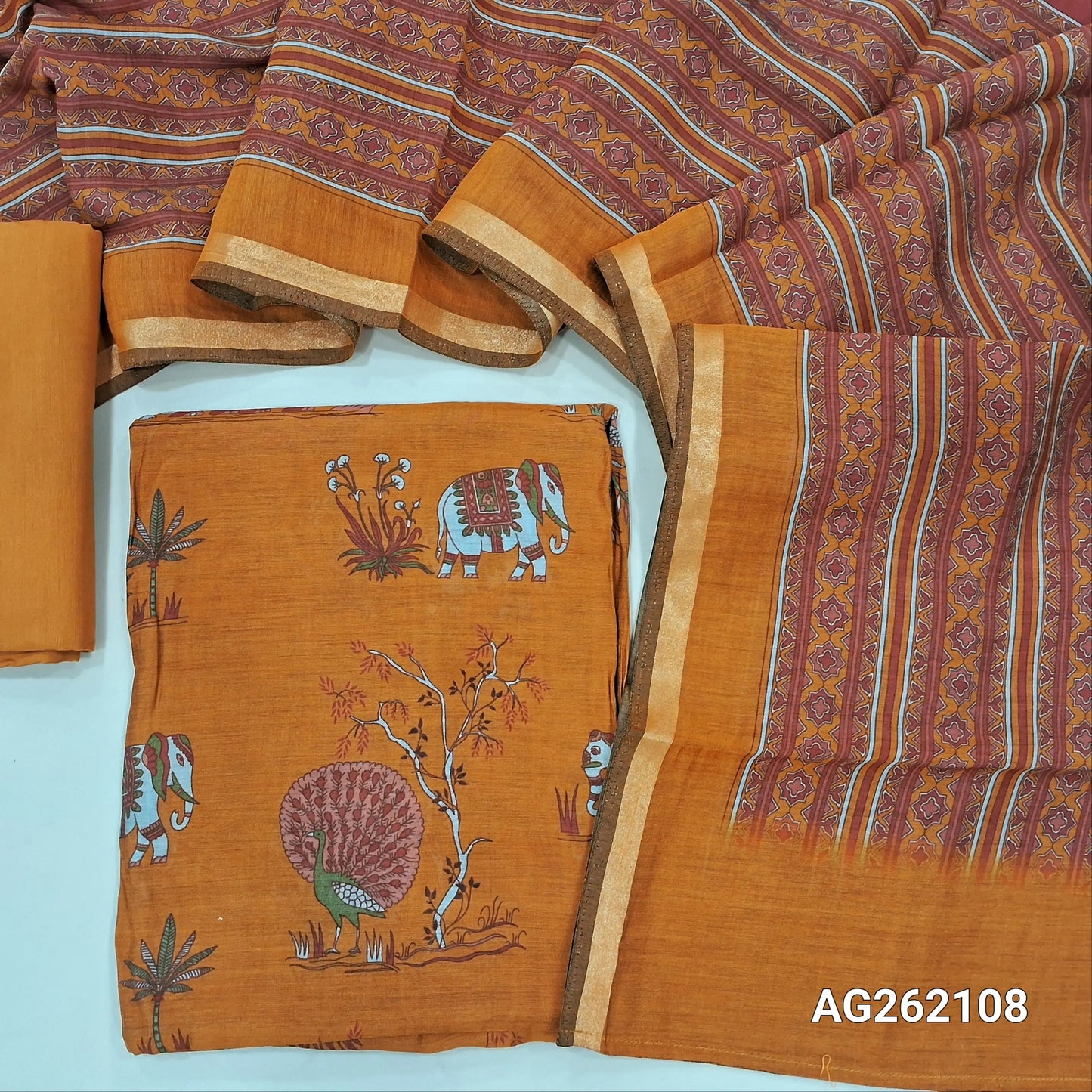 Light orange soft silk cotton unstitched salwar material, digital printed all over(lining needed) cotton bottom,printed full length soft silk cotton dupatta with tissue borders. AG262108