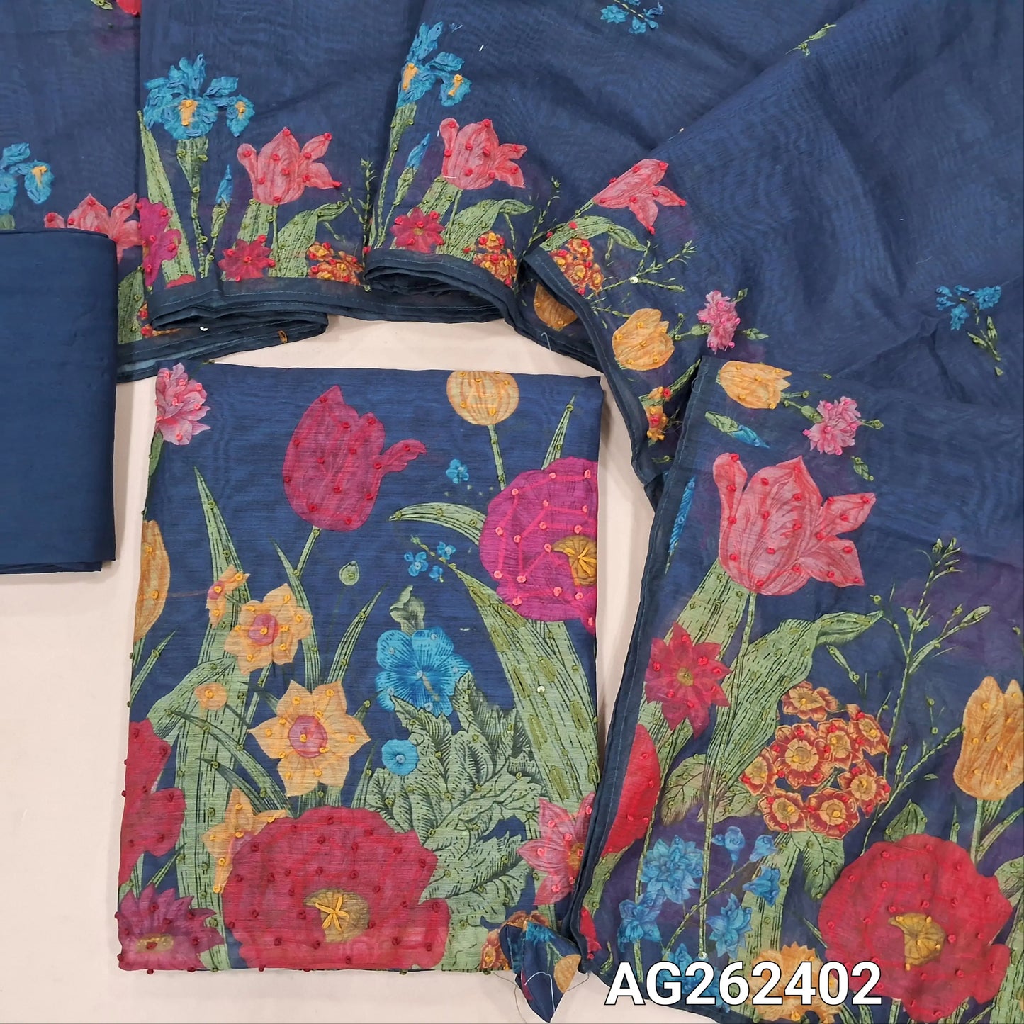 Dark Blue premium digital printed silk cotton unstitched salwar material with rich hand embroidery on yoke and daman (Thin, Lining Needed) Matching santoon bottom, digital printed silk cotton dupatta with hand embroidery work. AG262402