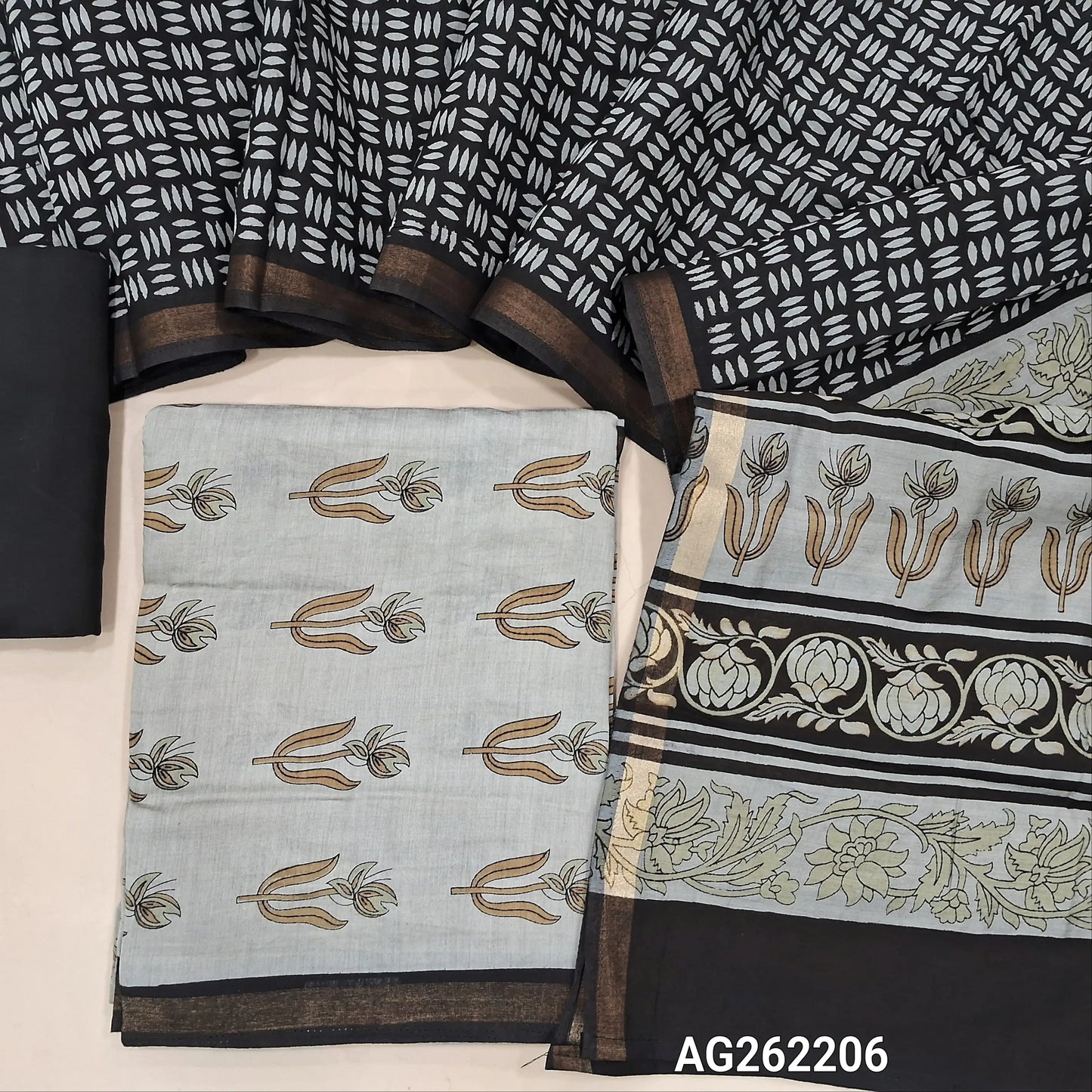 Light beige soft silk cotton unstitched salwar material, digital printed, contrast daman border with gold tissue (Lining Needed) black cotton bottom, soft silk cotton digital printed dupatta with borders. AG262206