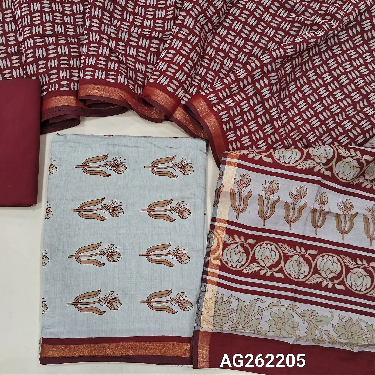 Light beige soft silk cotton unstitched salwar material, digital printed, contrast daman border with gold tissue (Lining Needed) Reddish maroon cotton bottom, soft silk cotton digital printed dupatta with borders. AG262205