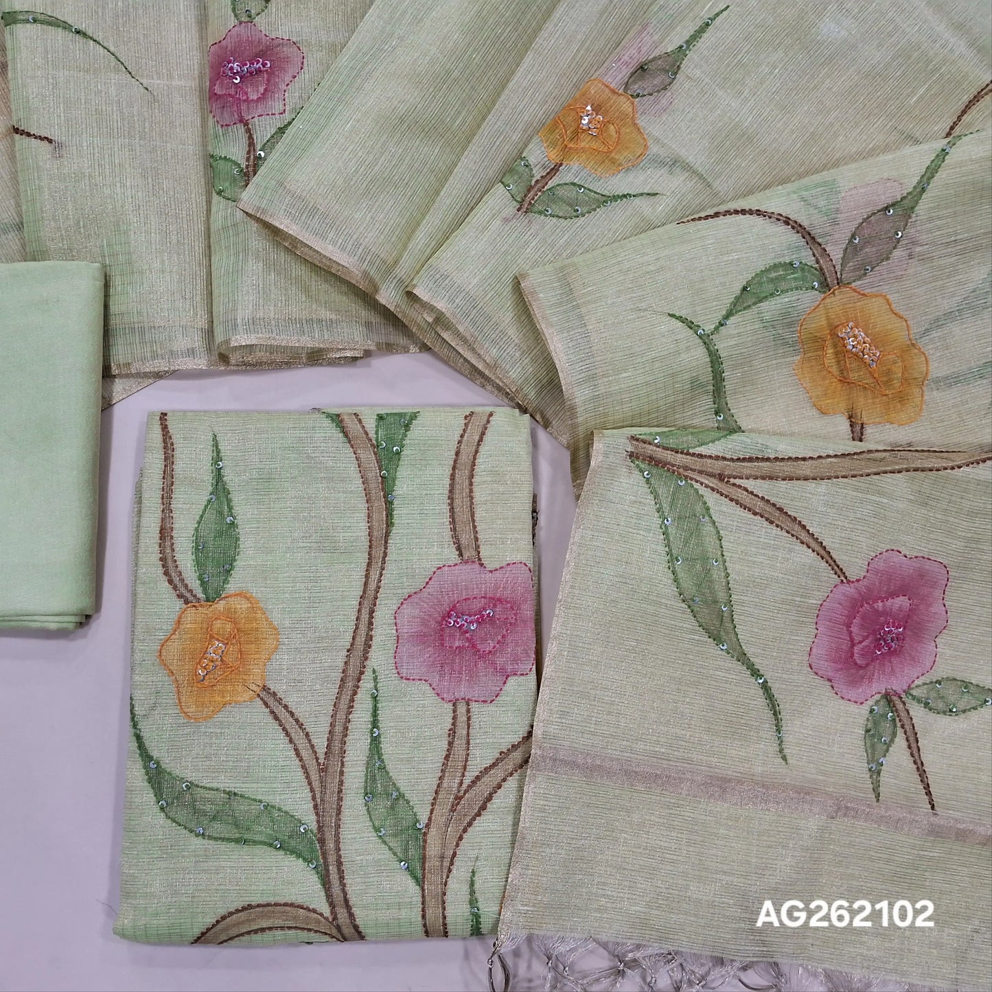 Designer pastel green golden tint tissue kota unstitched salwar material, floral design with hand brush paint, kantha stitch and sequins on front,(lining needed)santoon bottom,floral printed and brush paint on tissue kota dupatta. AG262102