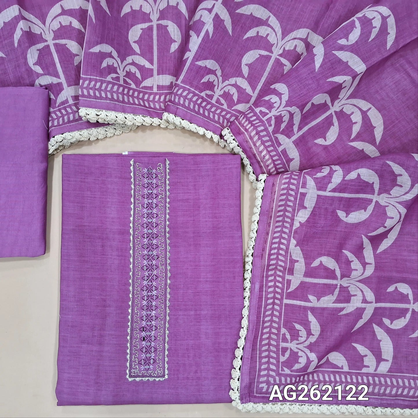 Purple semi linen unstitched salwar material(texture, lining needed) real mirror, zari work on yoke, tree print on front, matching silky bottom, one side of tree print semi linen dupatta with lace tapings. AG262122