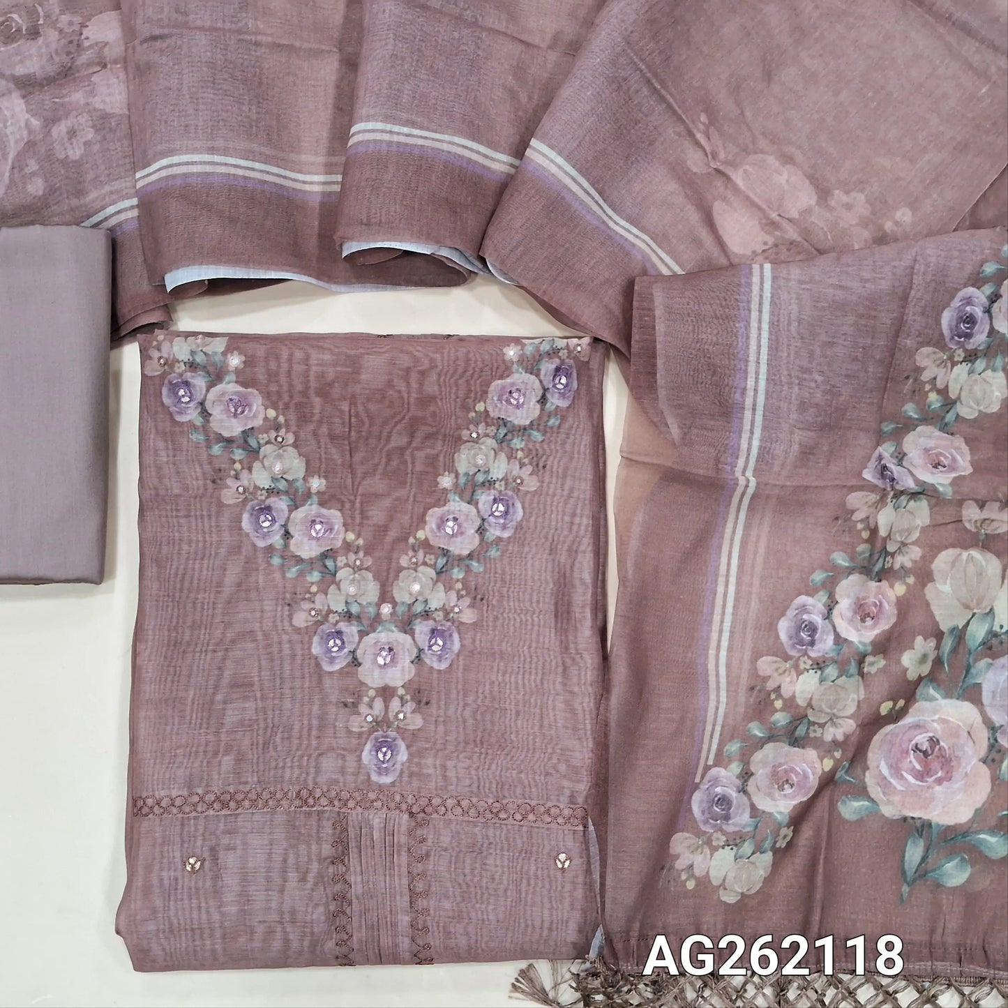 Designer mauve mul chanderi unstitched salwar material,digital printed and faux mirror yoke, pintex and thread work on middle,( soft,lining needed)silk cotton bottom,digital printed mul chanderi dupatta with fancy tassles. AG262118