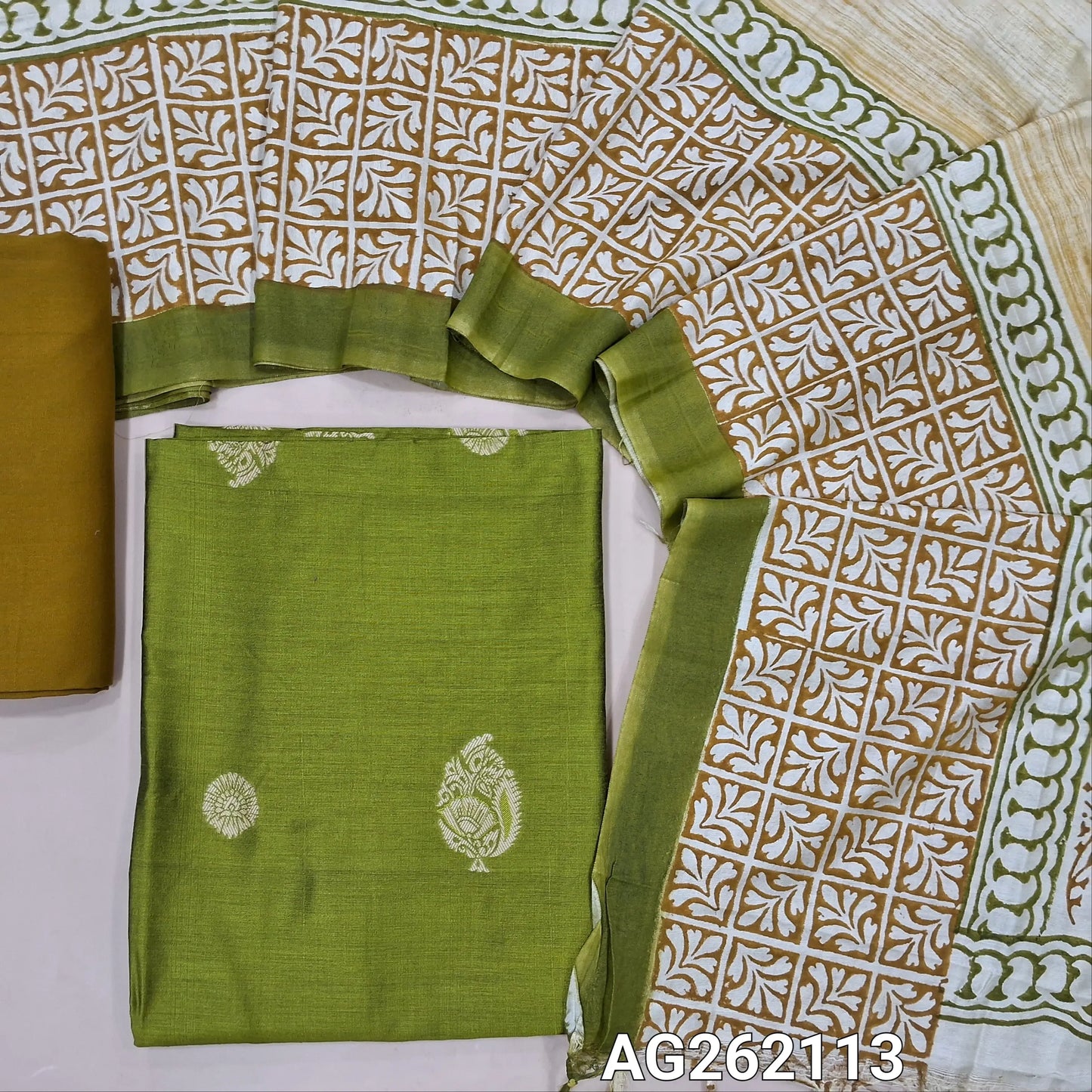 Light green benarasi silk cotton unstitched salwar material, thread woven buttas all over(Lining needed)mehandhi yellow spun cotton bottom,hand block printed silk cotton dupatta with tissue borders. AG262113