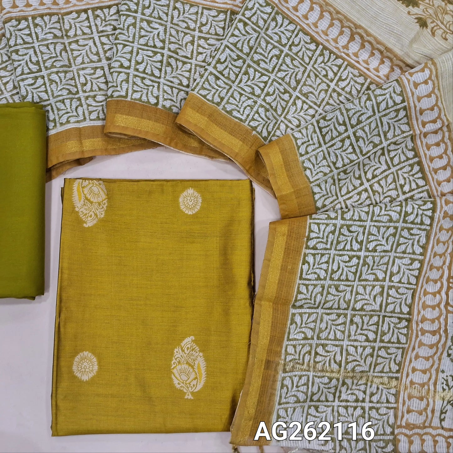 Mehandhi yellow benarasi silk cotton unstitched salwar material, thread woven buttas all over(Lining needed)mehandhi green spun cotton bottom,hand block printed pure kota cotton dupatta with tissue borders. AG262116