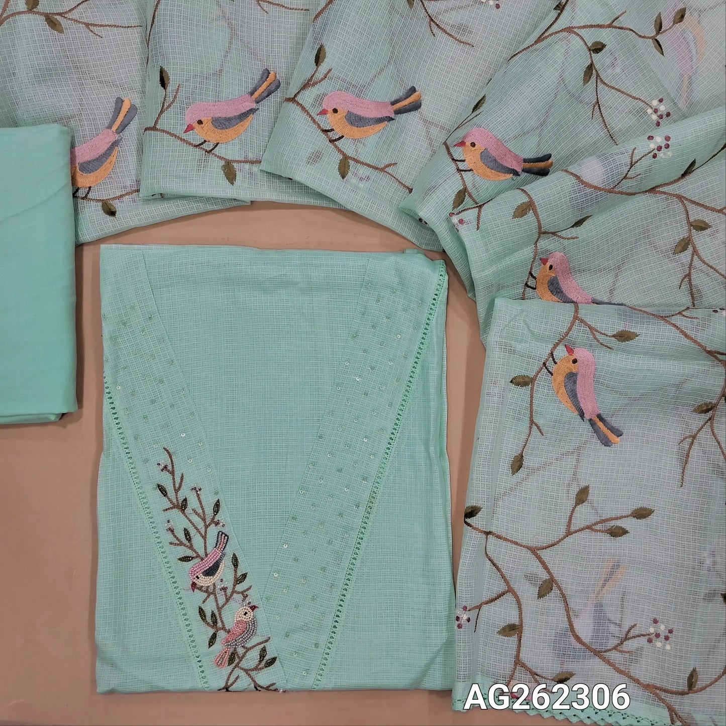 Designer pastel blue premium kota unstitched salwar material, V neck with bead and sequins detailing (Thin, Lining needed) matching cotton bottom, premium kota dupatta with rich thread embroidery all over and lace tapings. AG262306