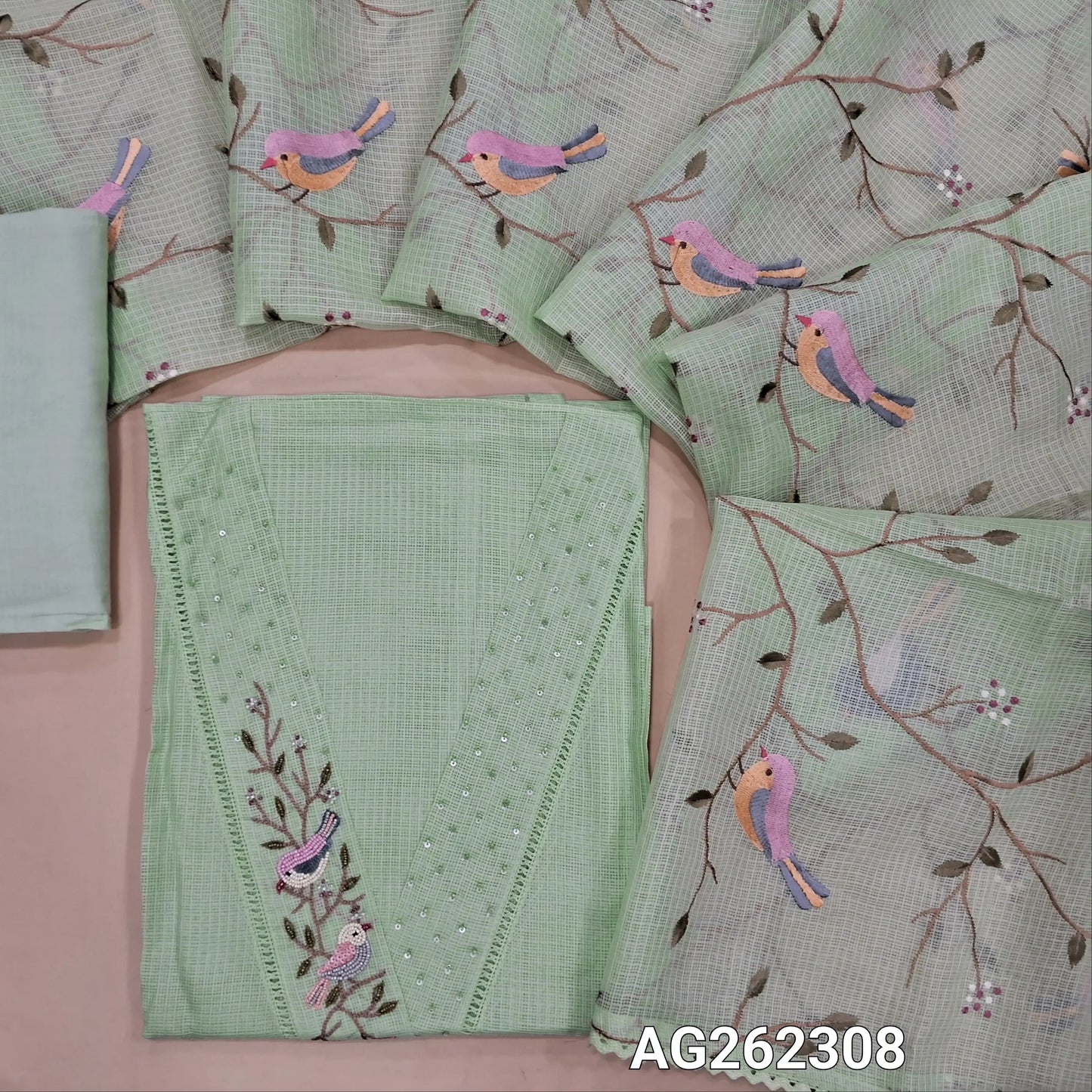 Designer pastel green premium kota unstitched salwar material, V neck with bead and sequins detailing (Thin, Lining needed) matching cotton bottom, premium kota dupatta with rich thread embroidery all over and lace tapings. AG262308