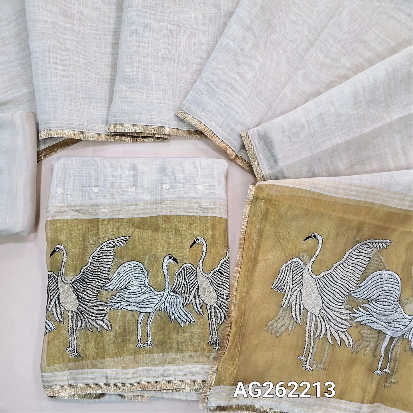 Rich beige premium silk cotton unstitched salwar material,zari buttas all over,silver& antique gold zari embroidery,tissue work on daman(lining needed)matching santoon bottom, soft silk cotton dupatta with silver gold tissue with zari work pallu. AG262213