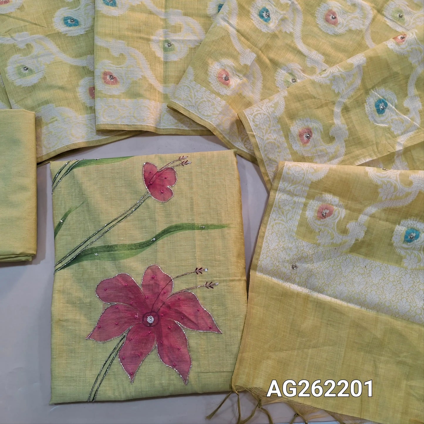 Pastel Yellow premium muga silk cotton unstitched salwar material, hand brush paint work on front with cut bead detailing (Lining Needed) matching santoon bottom, rich jamdani and meenakari woven muga silk cotton dupatta with cut bead work. AG262202