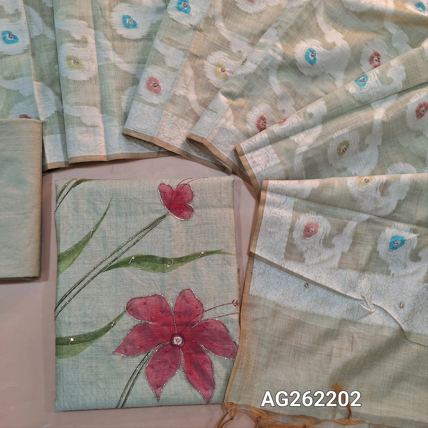 Pastel Green premium muga silk cotton unstitched salwar material, hand brush paint work on front with cut bead detailing (Lining Needed) matching santoon bottom, rich jamdani and meenakari woven muga silk cotton dupatta with cut bead work. AG262203