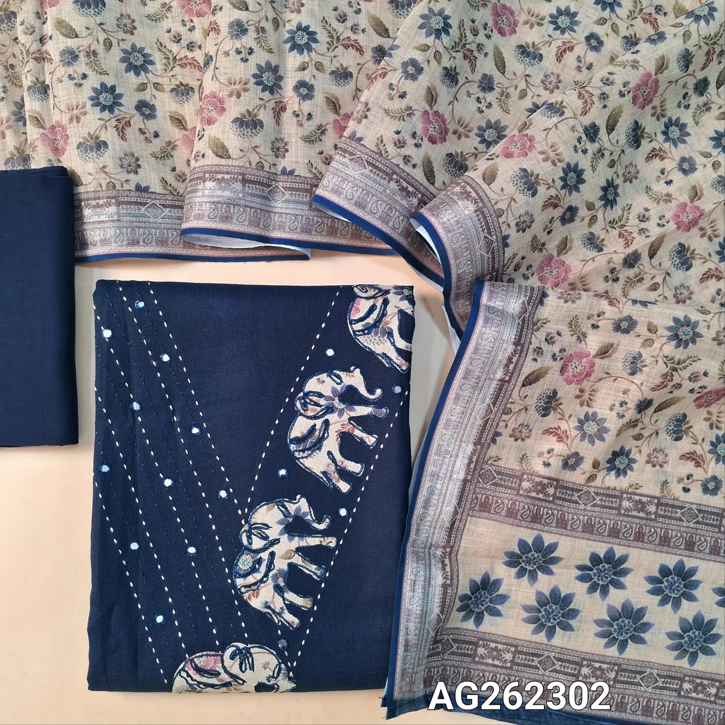 Navy Blue semi linen unstitched salwar material, V neckline with kantha, foil and applique work (Lining Optional) matching santoon bottom, semi linen floral printed dupatta with silver tissue borders. AG262302