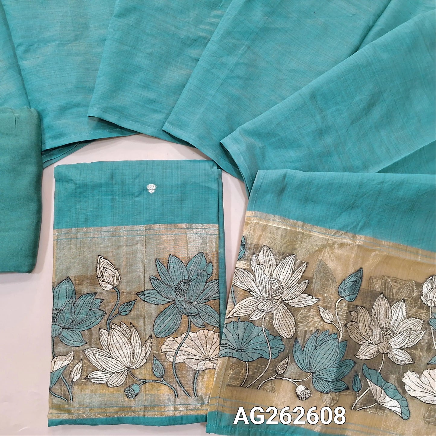 Pastel Blue fancy silk cotton unstitched salwar material, gold tissue daman with embroidery and zari weaving, small zari buttas on front (Lining Needed) matching bottom, silk cotton dupatta with weaving on pallu. AG262608